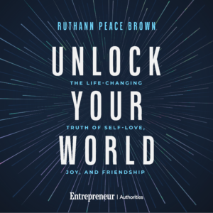 Book cover: 'Unlock Your World' by Ruthann Peace Brown with subtitle 'The Life-Changing Joy, and Friendship' set against a dark blue radiating lines background.